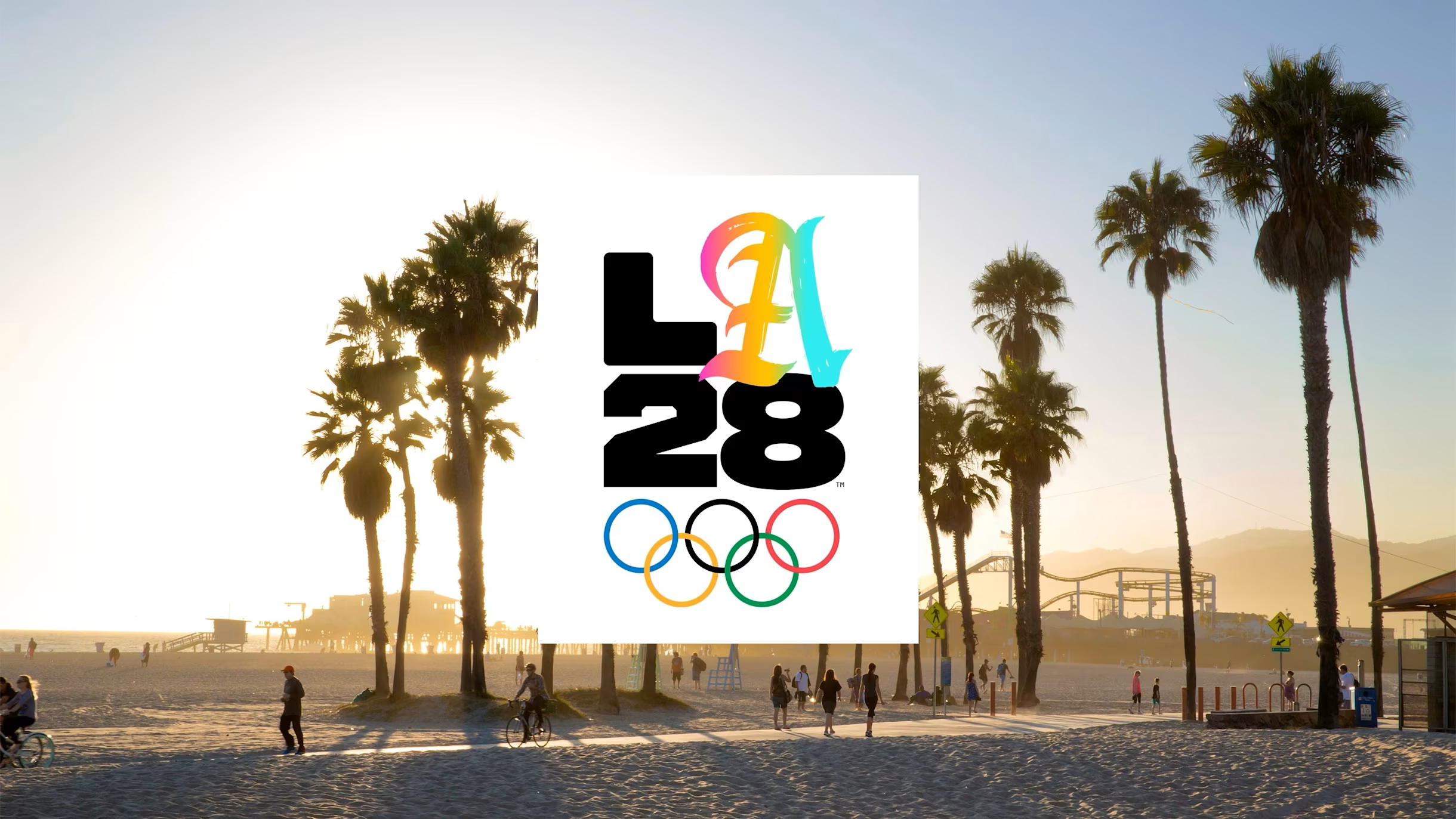 LA28 Olympics logo on Venice Beach with palm trees